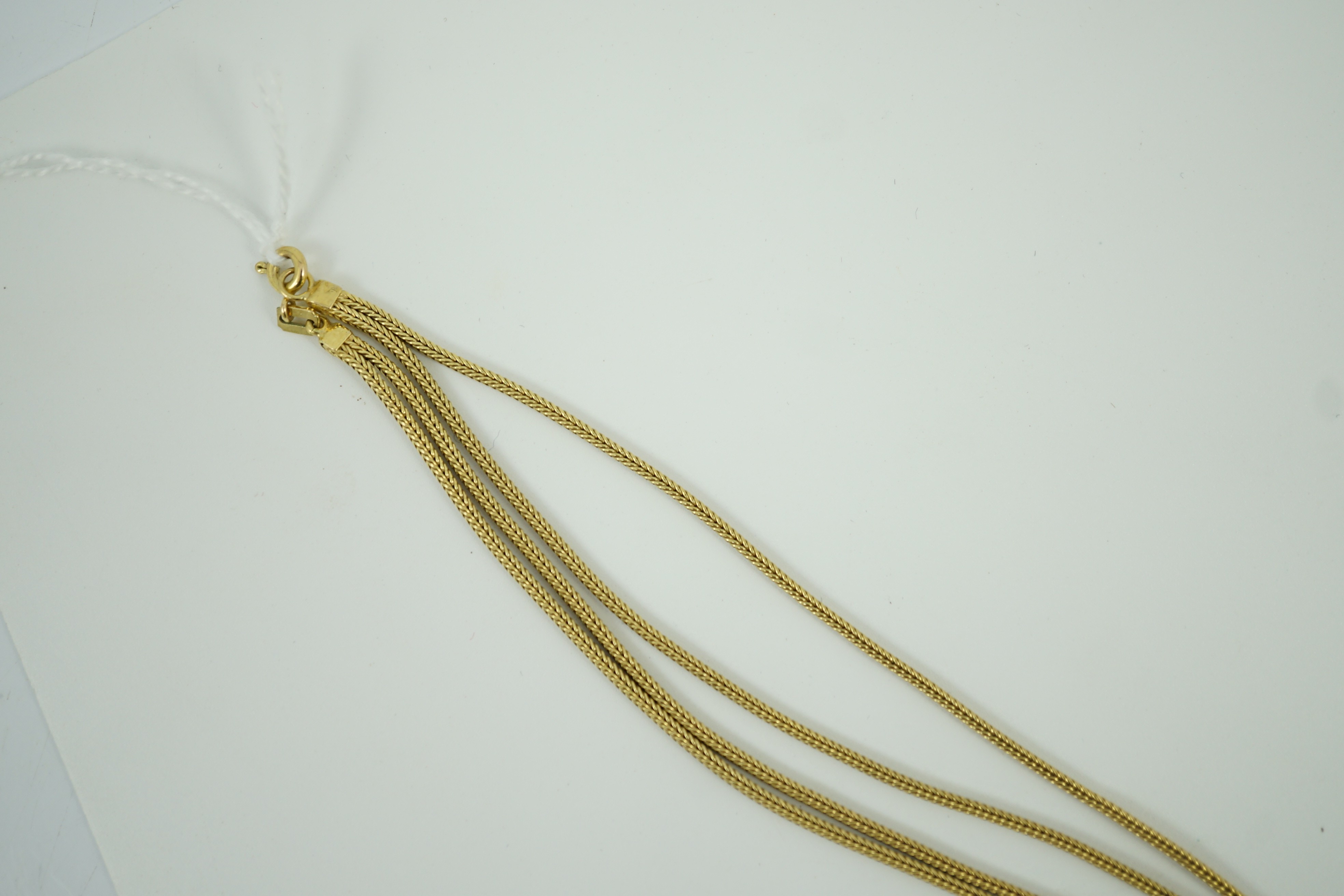 A modern 9ct gold quadruple strand tassel necklace, 56cm, 16.1 grams.